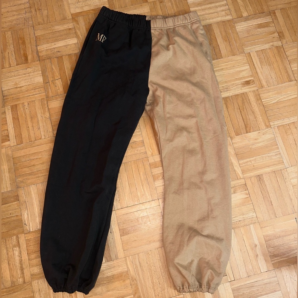 Tan and black luxury sweatpants. The Mayfair group
